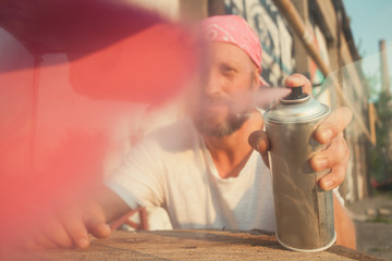 young man spray paint artist