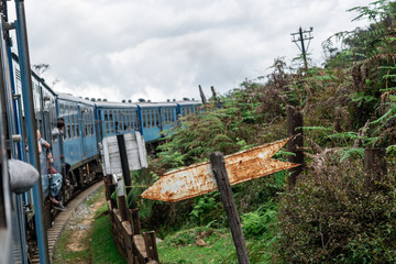 Train journey through scenic highlands of Sri Lanka. 