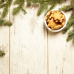 Delicious ginger biscuits. Fir branch. NewYear. Light background