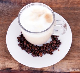 Cup of delicious coffee - Brown wooden background - Good morning - Cappuccino - Kaffeebohnen 