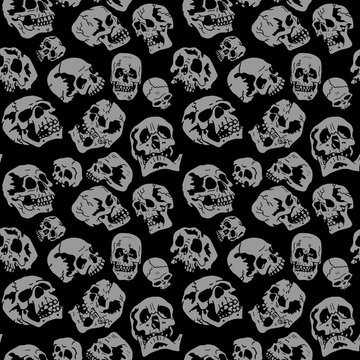 gray skulls on a black background vector halloween pattern