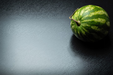 bright sweet berry-watermelon on a gray stone background with place for text