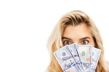 surprised emotional beautiful young girl holding money on white isolated background