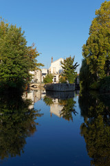 Fototapeta na wymiar Reflection on the Briare canal in Montargis city