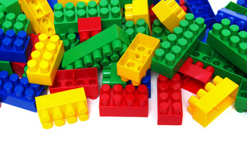 Plastic building blocks on white