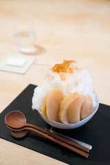 ice shave topped with freshly cut peach is a popular dish in Tokyo