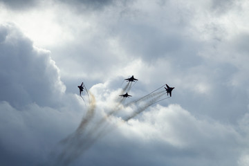 Jet military aircraft on the background of clouds