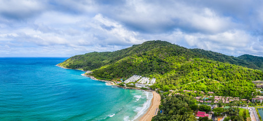 Fototapeta na wymiar aerial view panorama Phromthep cape and wind tubine viewpoint. .Phromthep cape is a famouse landmark and popular sunset viewpoint of Phuket Thailand.