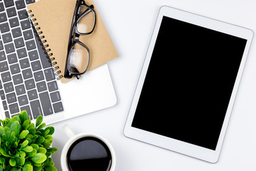 Workspace in office with tablet and with empty blank screens are on top,Top view with copy space.