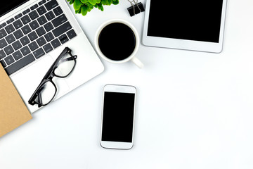 Workspace in office with tablet and smartphone with empty blank screens are on top,Top view with copy space.