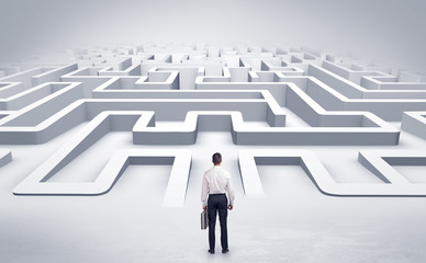 Businessman getting ready to enter a 3D flat labyrinth concept
