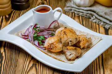 chicken kebab on board