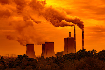 
Coal power plant at sunset sky
