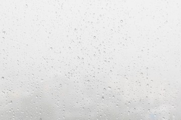 Rain water drops on blue background