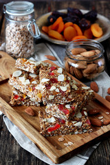Home made energy bar made of date, tahini, apricot, cashew, oat flakes, almonds and mix of seeds