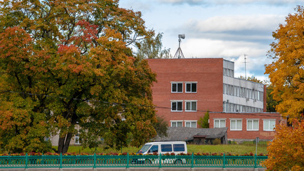Dobele, Latvia. Autumn city landscape with bridges and colorful maples.