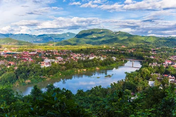 Fotobehang View of city along the Khan river of Luang Prabang, Laos © kudosstudio