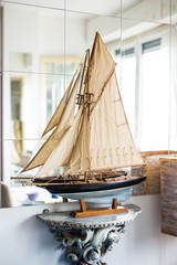 Hobby, interior and collecting concept - The layout of a sailboat in the room