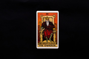 An individual major arcana tarot card isolated on black background. The Emperor.