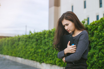 Asian business woman is stressed. Asian Young business woman unemployed. Asian office girl unemployed.