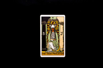 An individual major arcana tarot card isolated on black background. The High Priestess.
