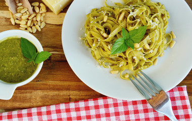 Basil Pesto Pasta on wooden background.
Pasta menu.