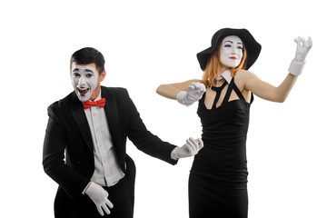 Mimes playing imaginary music instruments