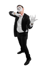 Male mime playing invisible violin