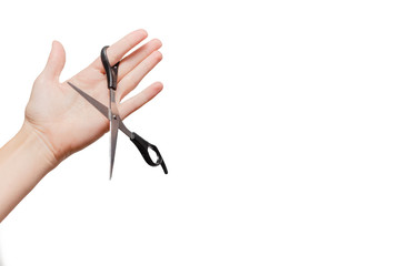 Femal hand holding scissors. Stationary  Concept. White background, isolated, close up