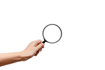 Femal hand holding magnidying glass. Detective and searchConcept. White background, isolated, close up