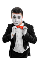 Man straightening red bow tie