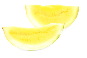 Sliced watermelon with yellow flesh on a white background