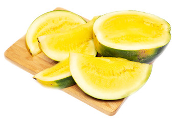 Sliced watermelon with yellow flesh on a white background