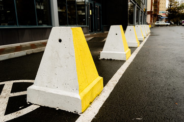 Pedestrian crossing near the parking lots, white and yellow stripes.Transport concept. Asphalt