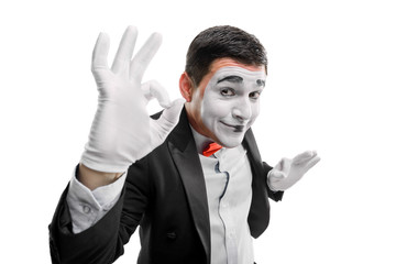 Mime actor showing OK sign
