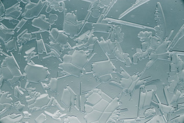 Snow patterns on glass as an abstract background