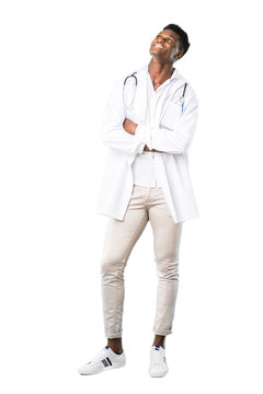 Full Body Of African American Doctor Stand And Looking Up While Smiling On White Background