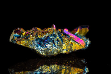 Macro mineral stone Titanium Quartz, Flame Aura Quartz on a black background