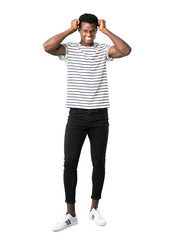 Fototapeta premium Full body of Dark skinned man with striped shirt annoyed angry in furious gesture. Negative expression on white background