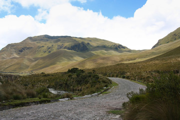 Fototapeta na wymiar Coblbe stones road climbing mountains near Otavalo in Ecuador