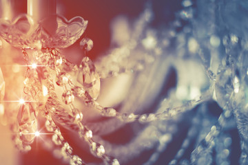 abstract image background of blur bokeh and crystal chandelier light equipment filter tone color...