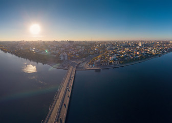 Aerial view to Chernavsky bridge over big river at sunset and view to right bank of Voronezh city, Russia
