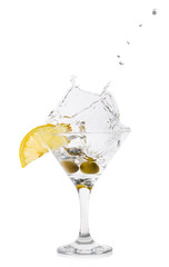 Martini splash with olives in a cocktail glass