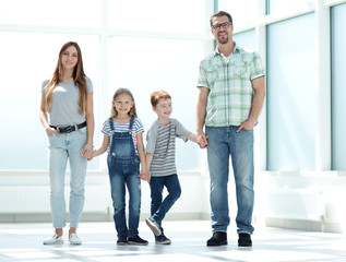 Fototapeta premium modern family standing in a new apartment