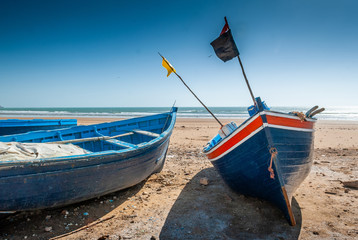 Fisherman's boat stranded on the beach of Tafelney, in the region of Essaouira in Morocco