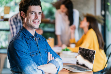 smart attractive caucasian man portrait with confident and happiness in cafe startup fouder ideas concept