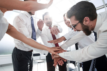business team connects their hands together