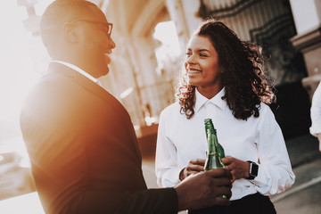 Smile. Alcoholic Beverage. Man and Woman. Stand.