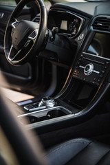 Obraz na płótnie Canvas Luxurious car interior view through the open passengers door