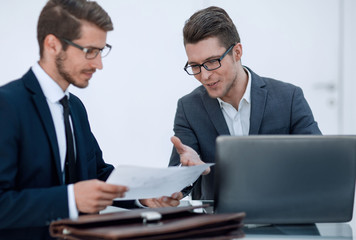 Fototapeta na wymiar close up.two business men discussing a business document
